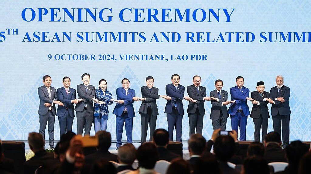 The leaders of the Association of Southeast Asian Nations (ASEAN) pose for a family picture doing the signature