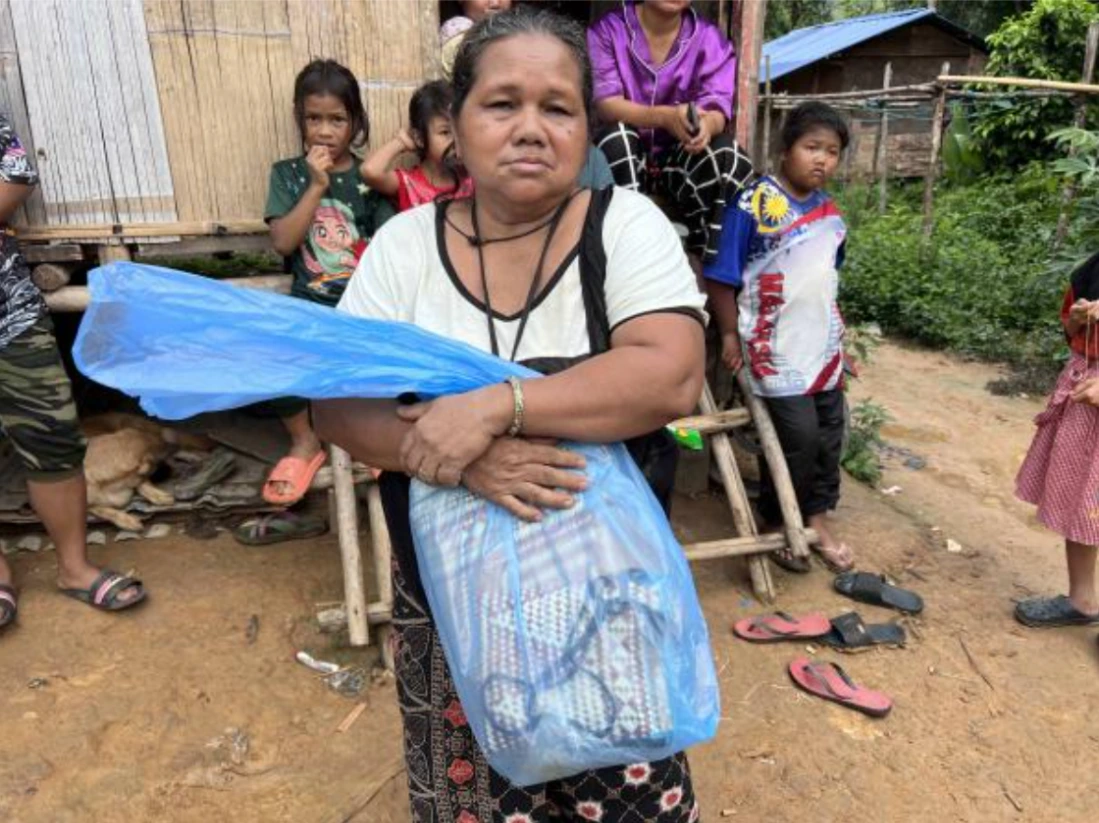 Alang Angah looks anguished as she speaks of her late father. She's the daughter of community patriarch Angah Alang, who was killed in the river amid a deluge that rushed downstream from the mining, allegedly after a mining pond barrier at a slope gave way. The mine operator denies fault. Photo: Malaysiakini