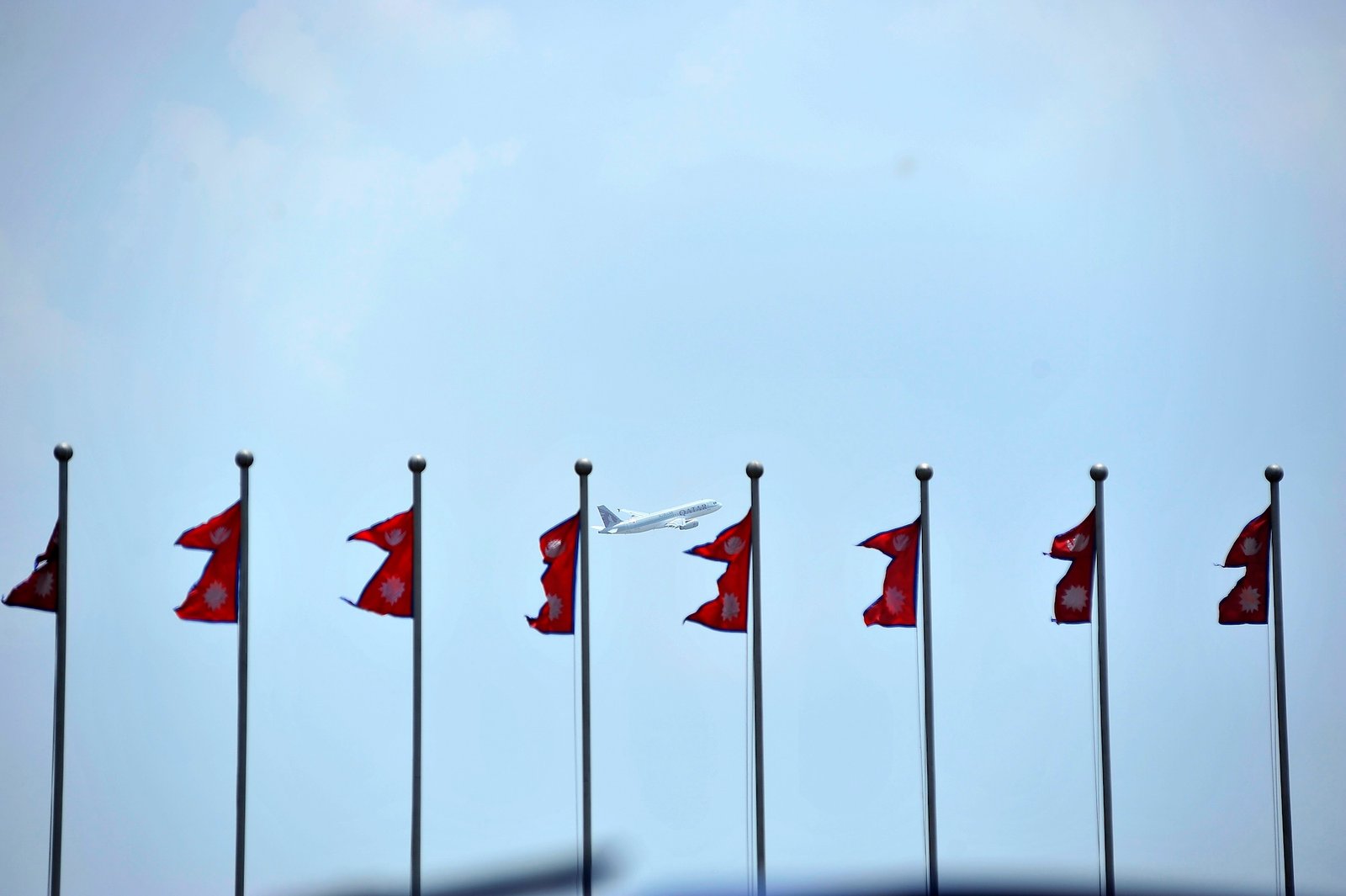The image shows a Qatar Airways flight departing from Kathmandu.
